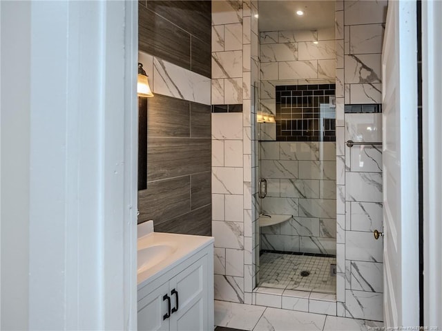 1206 Elm St N, Lumberton, NC 28358 - bathroom featuring a stall shower, vanity, marble look tiles, and tile walls