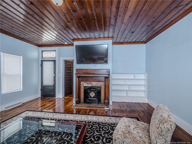 1206 Elm St N, Lumberton, NC 28358 - living room with crown molding, wood finished floors, baseboards, wooden ceiling, and a fireplace