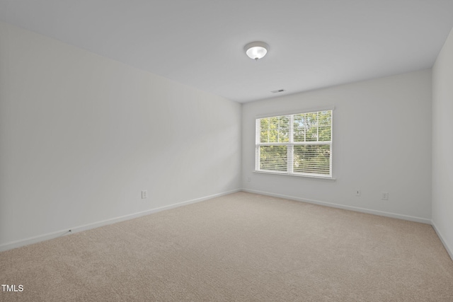 324 Farrow Glen Loop, Cary, NC 27519 - spare room with baseboards and light colored carpet