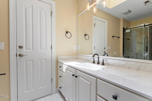 1211 E Pointe Dr, Durham, NC 27712 - bathroom featuring vanity, a shower with door, and tile patterned flooring