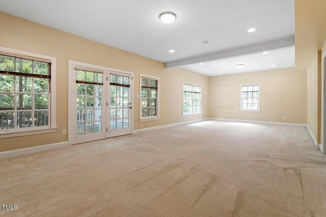 1211 E Pointe Dr, Durham, NC 27712 - carpeted empty room with baseboards, beam ceiling, and recessed lighting