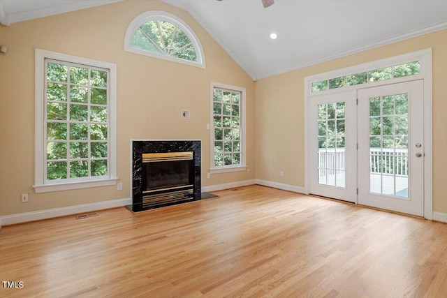 1211 E Pointe Dr, Durham, NC 27712 - unfurnished living room with crown molding, a high end fireplace, baseboards, wood finished floors, and a ceiling fan
