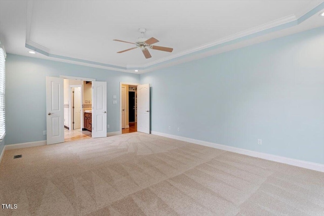 1211 E Pointe Dr, Durham, NC 27712 - unfurnished bedroom with a tray ceiling, baseboards, crown molding, light carpet, and recessed lighting