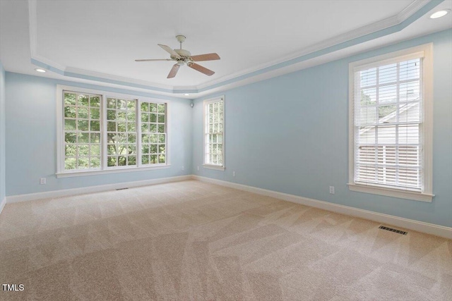 1211 E Pointe Dr, Durham, NC 27712 - unfurnished room featuring a tray ceiling, baseboards, ceiling fan, crown molding, and carpet