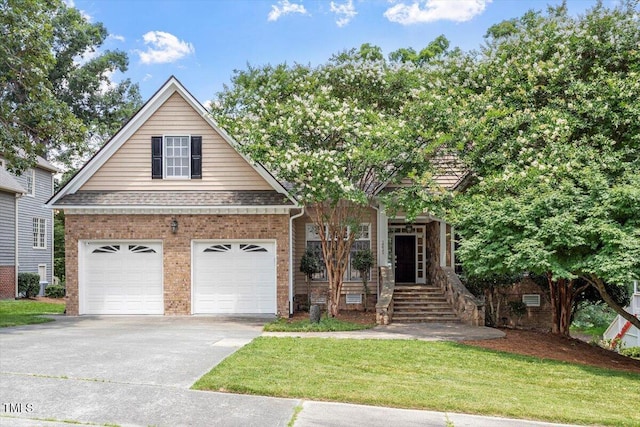 1211 E Pointe Dr, Durham, NC 27712 - view of front of home featuring driveway, brick siding, and a front lawn