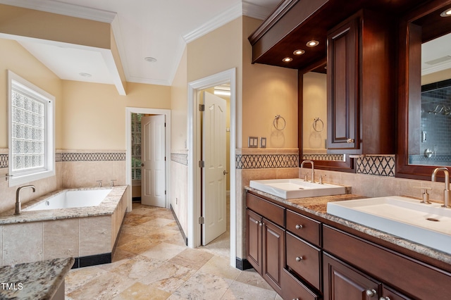1211 E Pointe Dr, Durham, NC 27712 - full bath with double vanity, crown molding, a garden tub, a wainscoted wall, and stone tile flooring