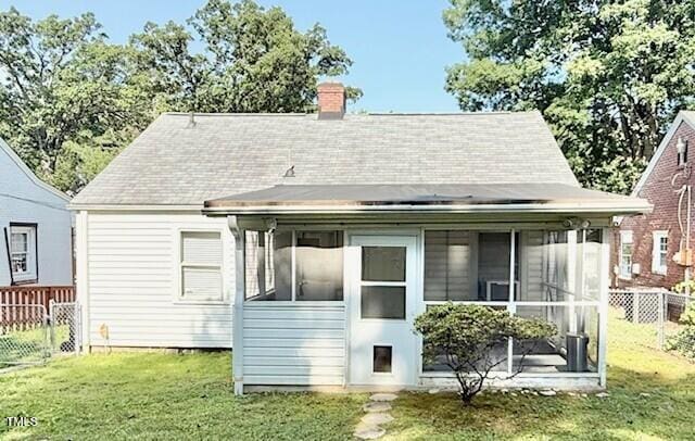 1112 N Driver St, Durham, NC 27701 - back of house with a sunroom and a chimney