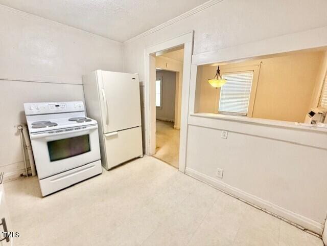 1112 N Driver St, Durham, NC 27701 - kitchen with white appliances, crown molding, and baseboards