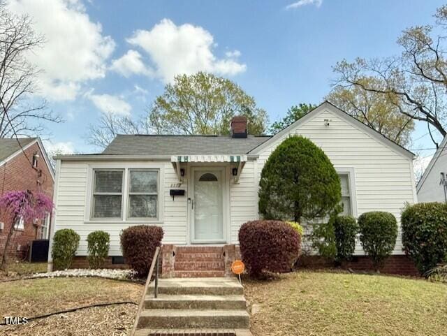 1112 N Driver St, Durham, NC 27701 - bungalow featuring entry steps, a chimney, and a front lawn