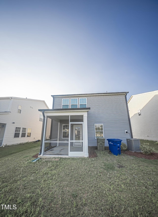 1108 Matterhorn Dr, Fuquay Varina, NC 27526 - rear view of house featuring a sunroom and a yard