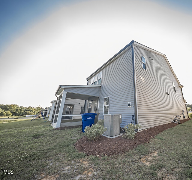 1108 Matterhorn Dr, Fuquay Varina, NC 27526 - view of property exterior with a cooling unit and a lawn