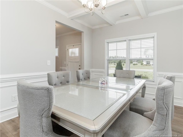 298 Turkey Trot Ln, Raeford, NC 28376 - dining space featuring a chandelier, a decorative wall, wood finished floors, beamed ceiling, and ornamental molding