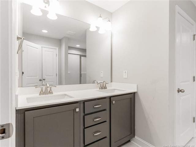 298 Turkey Trot Ln, Raeford, NC 28376 - bathroom with double vanity, baseboards, and a shower with shower door