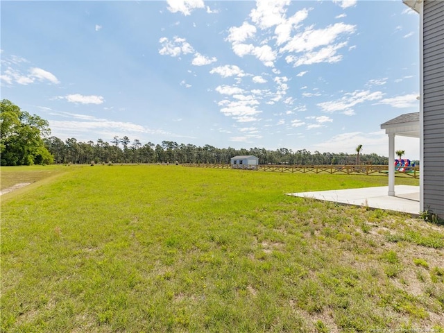 298 Turkey Trot Ln, Raeford, NC 28376 - view of grassy yard featuring a patio