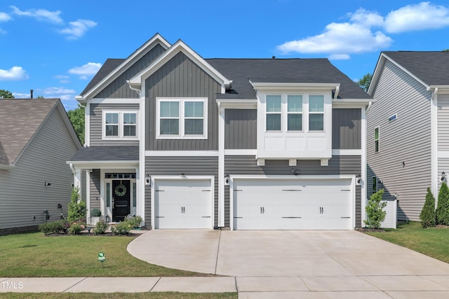 325 Buckhorn Branch Park, Clayton, NC 27520 - view of front of property with board and batten siding, an attached garage, concrete driveway, and a front lawn