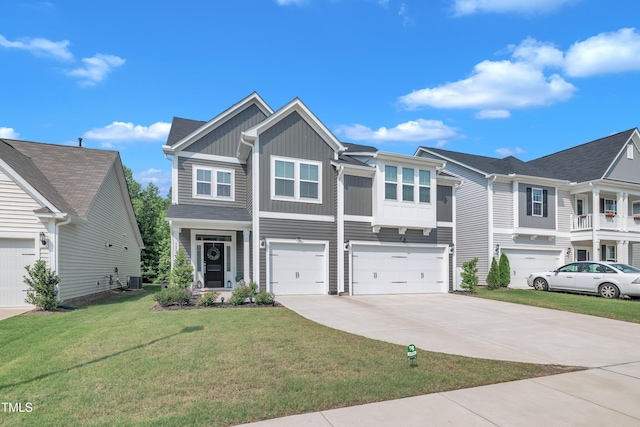 325 Buckhorn Branch Park, Clayton, NC 27520 - view of front of house with board and batten siding, driveway, a garage, and a front yard