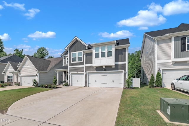 325 Buckhorn Branch Park, Clayton, NC 27520 - view of front of home featuring board and batten siding, concrete driveway, an attached garage, and a front lawn