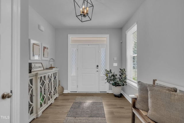 325 Buckhorn Branch Park, Clayton, NC 27520 - entryway featuring a chandelier, light wood-type flooring, and baseboards