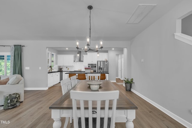 325 Buckhorn Branch Park, Clayton, NC 27520 - dining space featuring healthy amount of natural light, baseboards, light wood-style floors, and recessed lighting