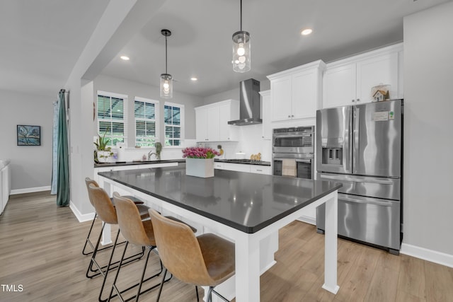325 Buckhorn Branch Park, Clayton, NC 27520 - kitchen featuring stainless steel appliances, wall chimney range hood, dark countertops, baseboards, and recessed lighting