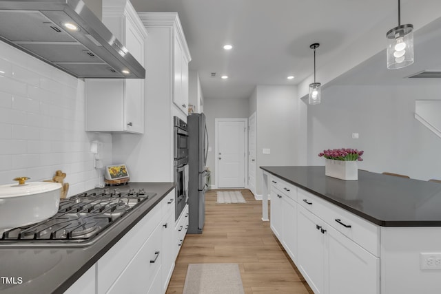 325 Buckhorn Branch Park, Clayton, NC 27520 - kitchen featuring wall chimney exhaust hood, dark countertops, recessed lighting, light wood-style floors, and white cabinets