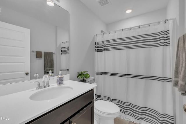325 Buckhorn Branch Park, Clayton, NC 27520 - bathroom featuring toilet, vanity, curtained shower, and tile patterned flooring