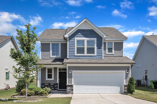 520 Oak Holly Ln, Zebulon, NC 27597 - view of front of home featuring an attached garage, concrete driveway, a shingled roof, and stone siding