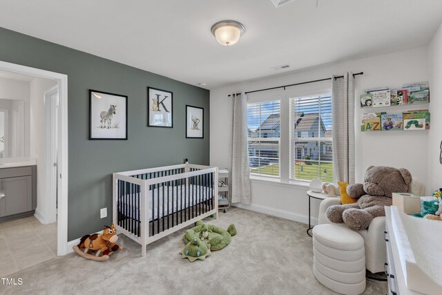 520 Oak Holly Ln, Zebulon, NC 27597 - bedroom featuring baseboards, a crib, and light carpet