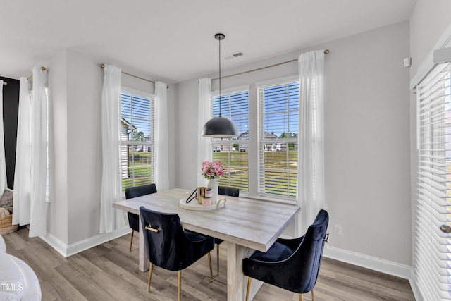 520 Oak Holly Ln, Zebulon, NC 27597 - dining space with plenty of natural light, wood finished floors, and baseboards