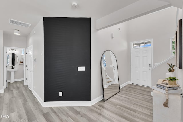 520 Oak Holly Ln, Zebulon, NC 27597 - foyer featuring light wood-style flooring, stairs, and baseboards