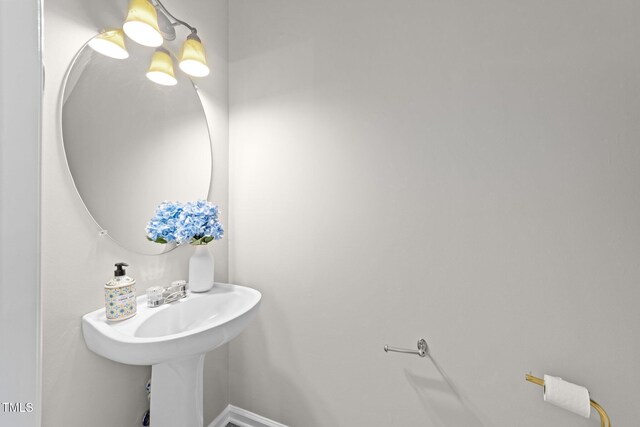 5717 Corbon Crest Ln, Raleigh, NC 27612 - bathroom with baseboards