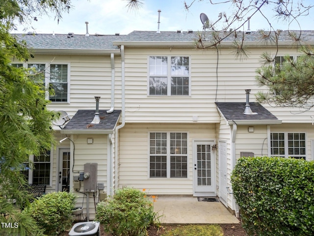 5717 Corbon Crest Ln, Raleigh, NC 27612 - rear view of property featuring a patio area and a shingled roof