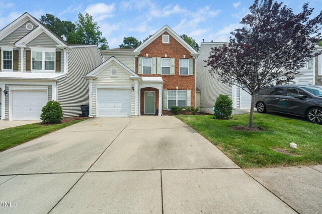 306 Berlin Way, Morrisville, NC 27560 - traditional-style house with concrete driveway, brick siding, and a front lawn