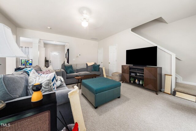 306 Berlin Way, Morrisville, NC 27560 - living room featuring light carpet, a ceiling fan, stairs, and decorative columns