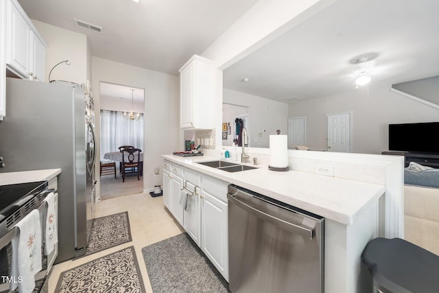 306 Berlin Way, Morrisville, NC 27560 - kitchen featuring stainless steel dishwasher, a sink, white cabinetry, and light countertops