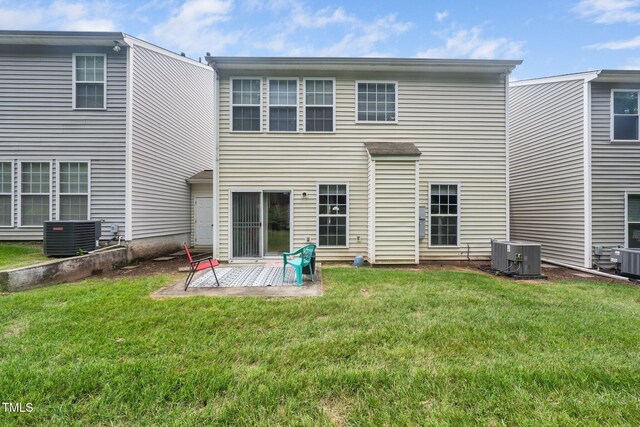 306 Berlin Way, Morrisville, NC 27560 - rear view of house with cooling unit, a patio, and a yard