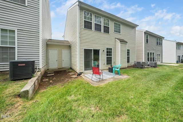 306 Berlin Way, Morrisville, NC 27560 - back of house featuring central AC, a lawn, and a patio