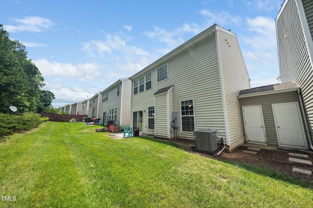 306 Berlin Way, Morrisville, NC 27560 - rear view of house with central AC unit and a lawn