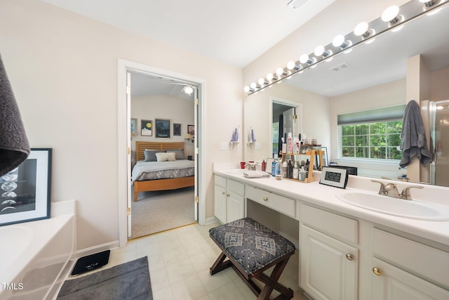 306 Berlin Way, Morrisville, NC 27560 - ensuite bathroom featuring double vanity, a bath, and baseboards