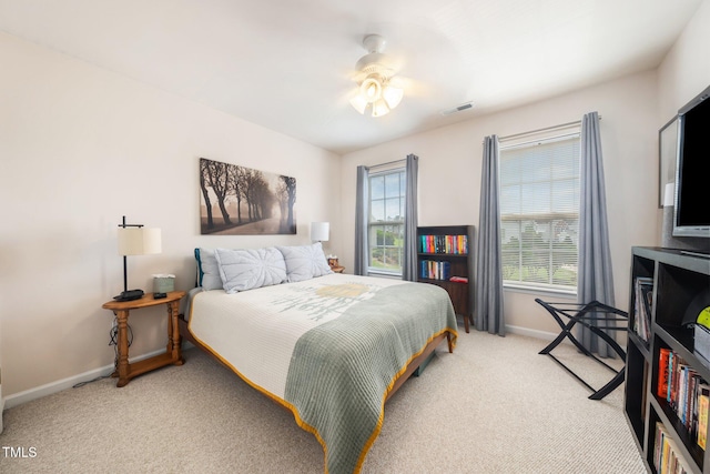 306 Berlin Way, Morrisville, NC 27560 - bedroom with light carpet, baseboards, and multiple windows