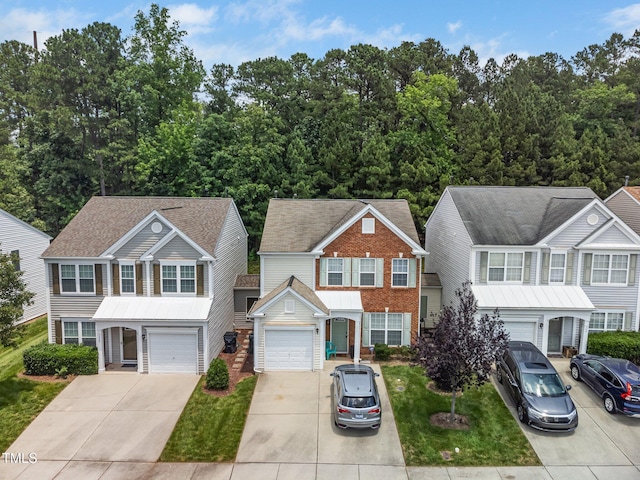 306 Berlin Way, Morrisville, NC 27560 - view of front of home featuring driveway and brick siding