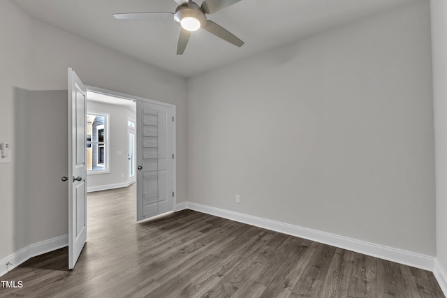 1217 Linkwood Way, Fuquay Varina, NC 27526 - unfurnished room featuring dark wood-type flooring, a ceiling fan, and baseboards