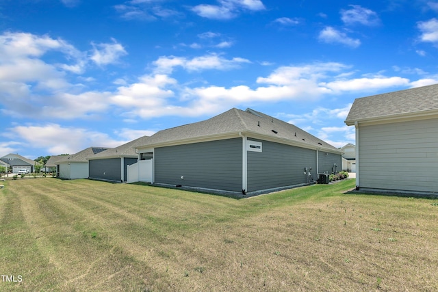 1217 Linkwood Way, Fuquay Varina, NC 27526 - back of house with a lawn and central air condition unit