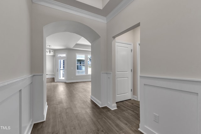 1217 Linkwood Way, Fuquay Varina, NC 27526 - hallway featuring arched walkways, ornamental molding, dark wood finished floors, and baseboards
