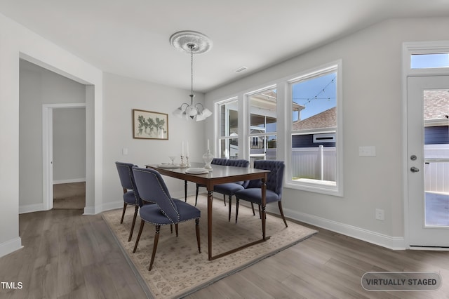 1217 Linkwood Way, Fuquay Varina, NC 27526 - dining area with a chandelier, wood finished floors, and baseboards