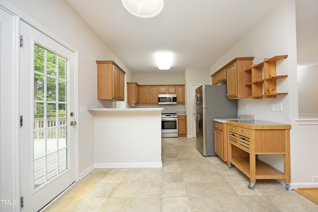 803 High Ct, Hillsborough, NC 27278 - kitchen with appliances with stainless steel finishes, open shelves, light countertops, and brown cabinets