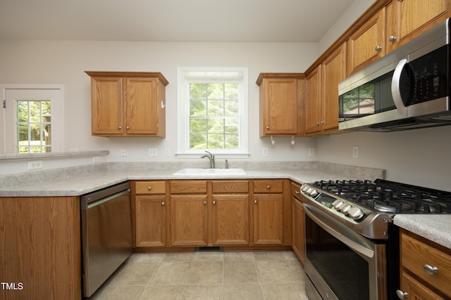 803 High Ct, Hillsborough, NC 27278 - kitchen with stainless steel appliances, a sink, brown cabinets, and light countertops