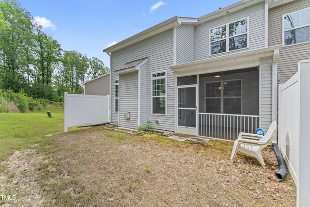 515 Historic Dr, Hillsborough, NC 27278 - rear view of property featuring a sunroom and a lawn