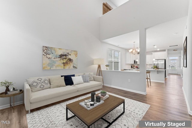 515 Historic Dr, Hillsborough, NC 27278 - living area featuring a chandelier and light wood-style flooring