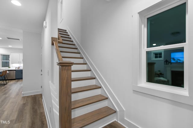 1534 Millrock Trl, Wendell, NC 27591 - stairs featuring wood finished floors, recessed lighting, and baseboards